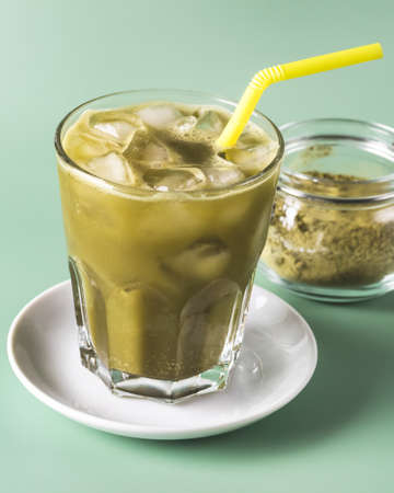 Homemade Iced Matcha Tea with Ice Cold Healthy Detox Drink Verticalの写真素材