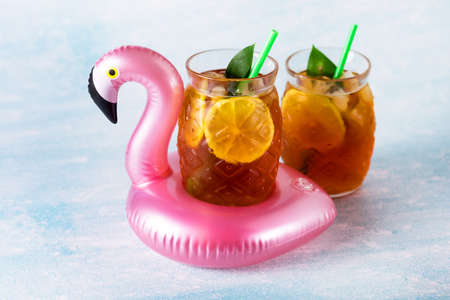 Traditional Iced Tea with Lemon and Ice in Glasses in Shape of Pineapple Horizontalの写真素材