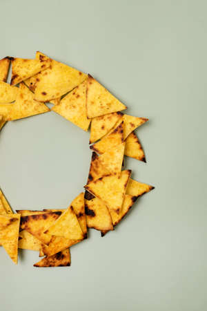 Homemade Tortilla Chips on Green Background Vertical Top Viewの写真素材