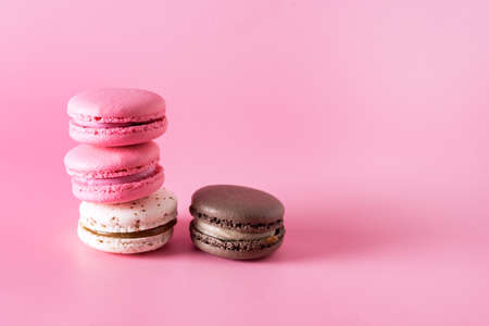 French Colorful Macarons Colorful Pastel Macarons on Pink Background White Pink and Brown Macaron Tasty Modern Dessert Copy Spaceの写真素材