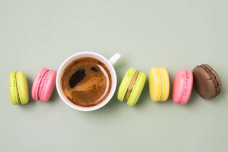 Delicious Colorful Macarons with Cup of Coffee Macaron Candy Modern French Dessert Horizontal Top Viewの写真素材