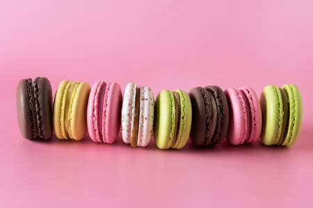 Sweet Colorful Macarons on Pink Background Tasty Colorful Macaroons French Dessert Horizontalの写真素材