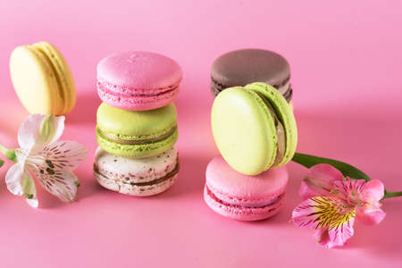 Colored Macarons Modern French Delicate Dessert Lemon Pistachio Strawberry Vanilla Macarons Flowersの写真素材