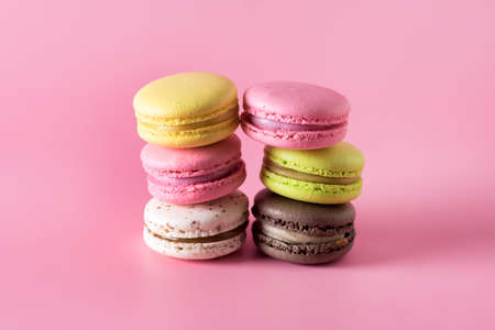 Sweet Colorful Macarons on Pink Background Tasty Colorful Macaroons French Dessert Horizontalの写真素材