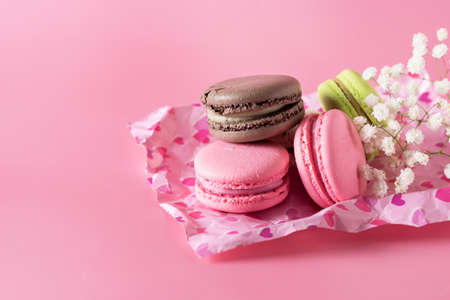 Macarons of Different Color on Pink Background Horizontal Copy Spaceの写真素材