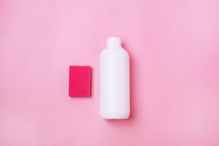 Pink Cleaning Sponges and Bottle of Detergent on Pink Background Horizontalの写真素材