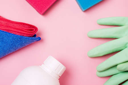 White Bottle With Cleaning Napkin on Pink Background Eco Cleaning Concept Surface with Absorbent...