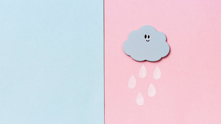 Small Handmade Toy in Shape of Clouds with Rain on Blue and Pink Background with Copy Space HandMade Toys Abstract Skyの写真素材