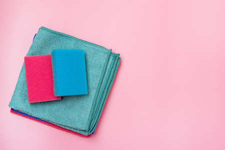 Two Sponges and Napkin on Pink Background Top View Copy Space Horizontalの写真素材