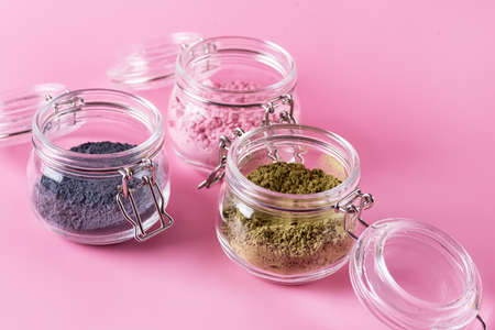 Different of japanese matcha tea green red and blue in glass jars on Pink Background Acai Berry Powder green tea leaf powder clitoria flower powder place for textの写真素材