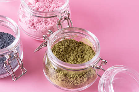 Different of japanese matcha tea green red and blue in glass jars on Pink Background Acai Berry Powder green tea leaf powder clitoria flower powder place for textの写真素材