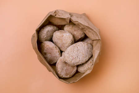 Heap of Frozen Meat Cutlet on Yellow Background Horizontal Top View Frozen Semi-finished Productsの写真素材