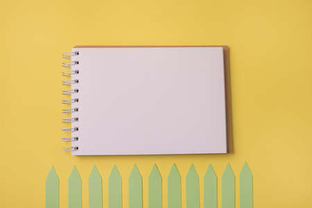 Open Spiral Notepad on a Yellow Background Notebook Lie on Yellow Paper Background Flat Lay Concept Horizontalの写真素材