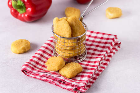 chicken nuggets with tomato sauce on wooden background. copy spaceの写真素材