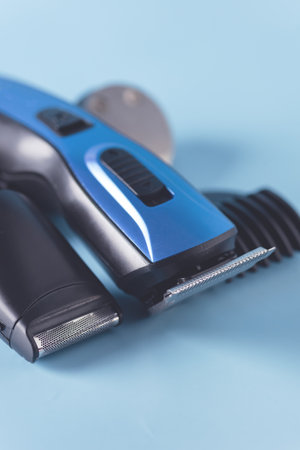 Modern Battery Electric Shaver for Man on Blue Background with Clipping Path Close Up Verticalの写真素材