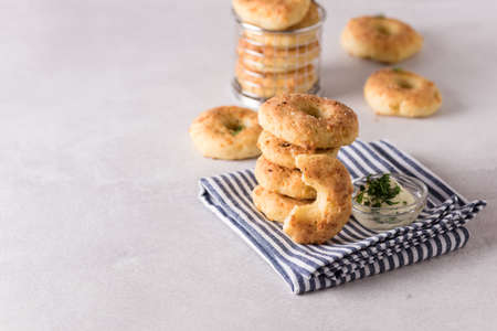Stack of Homemade and Tasty Cheese Donuts with Spices on Napkin Horizontal Copy Spaceの写真素材