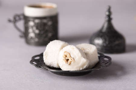 Turkish Coffee with Turkish Delights Traditional Embossed Metal Cup with Coffee Gray Backgroundの写真素材