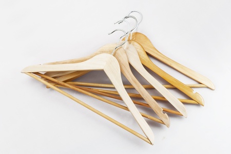 Wooden hanger, it is isolated on a white background 
