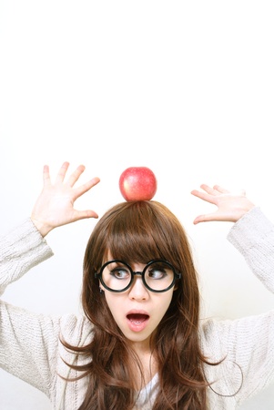 Young beauty woman with green apple isolated on whiteの写真素材