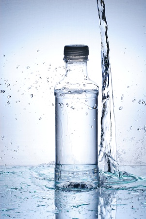 Water splash out of glassの写真素材