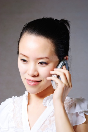 Attractive businesswoman using mobile phoneの写真素材