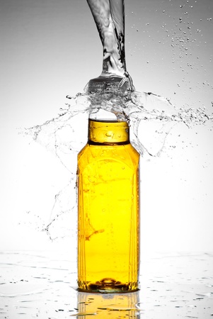 Water splash out of glassの写真素材