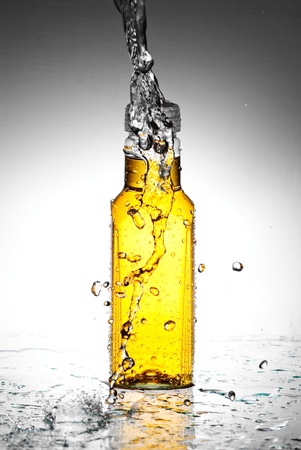 Water splash out of glassの写真素材