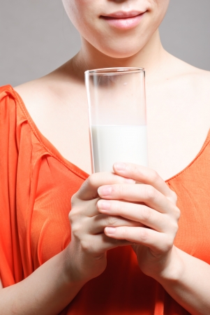 Young Woman with a glass of milkの写真素材