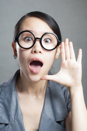 Young woman yelling isolated on white background.の写真素材