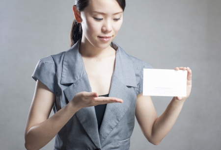 Beautiful business woman with a white banner.の写真素材
