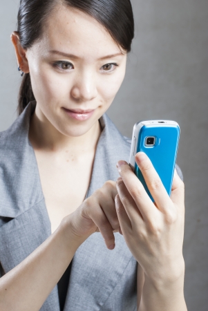 Attractive businesswoman using mobile phoneの写真素材