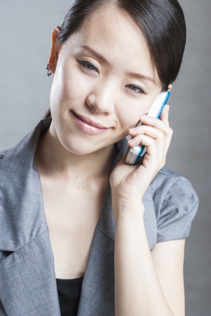 Attractive businesswoman using mobile phoneの写真素材