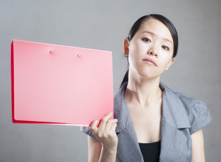 bright picture of beautiful woman with foldersの写真素材