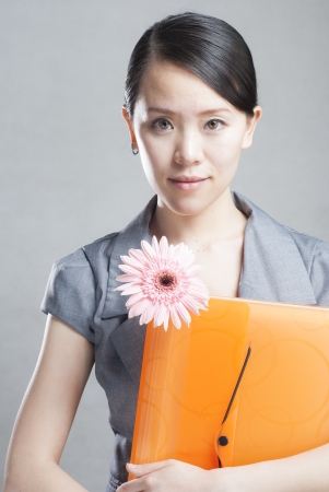 bright picture of beautiful woman with foldersの写真素材