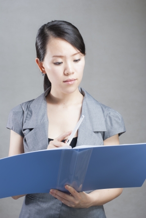 bright picture of beautiful woman with foldersの写真素材