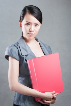 bright picture of beautiful woman with foldersの写真素材