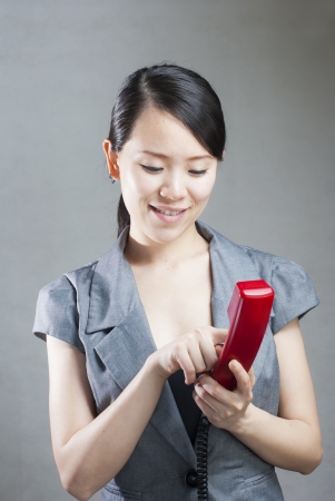 Attractive businesswoman using mobile phoneの写真素材