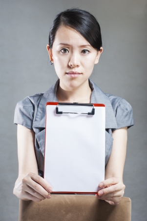 Beautiful business woman with a white banner.の写真素材