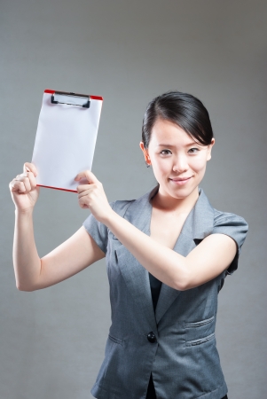 Beautiful business woman with a white banner.の写真素材