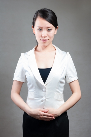 Young pretty business woman with notebook in the officeの写真素材