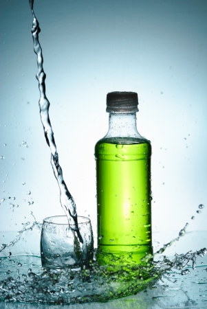 Water splash out of glassの写真素材