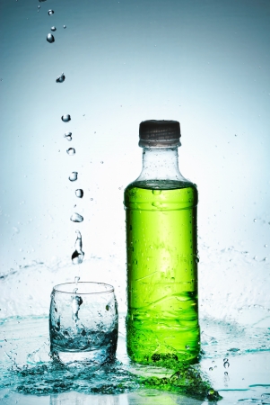 Water splash out of glassの写真素材