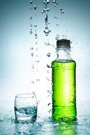 Water splash out of glassの写真素材