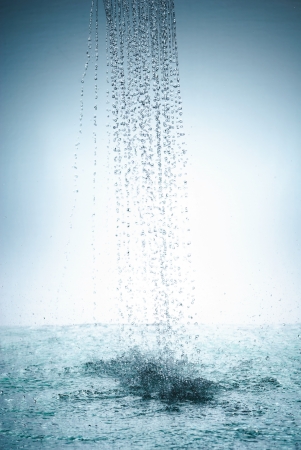 Water splash out of glassの写真素材