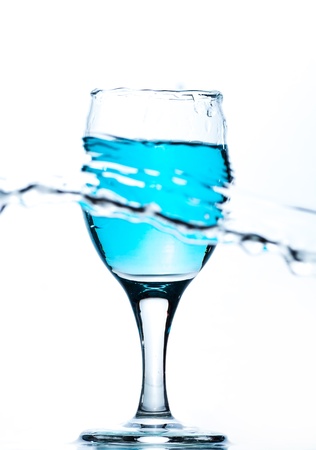 Water splash out of glassの写真素材
