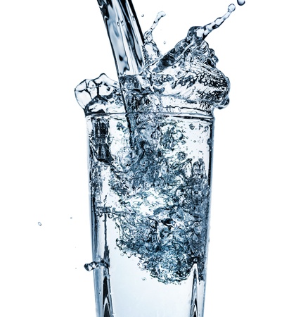 Water splash out of glassの写真素材