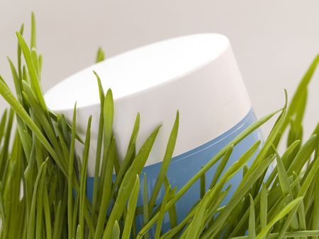 Jar of luxury face cream with fresh green grass - beauty treatment, beauty concept.の写真素材