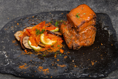 A hearty beef stew accompanied by a side of flavorful ratatouille.の写真素材
