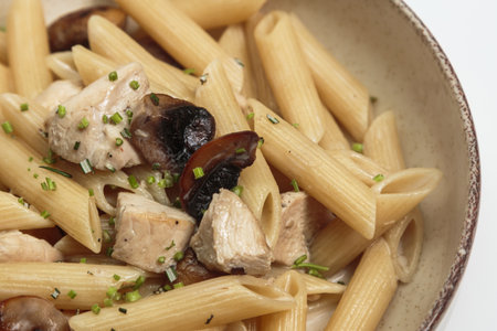 Penne Pasta with Chicken and Mushrooms in Creamy Sauceの写真素材