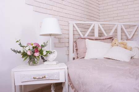 Old fashion table lamp on table on brick wall backgroundの写真素材